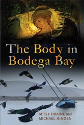 Body in Bodega Bay: The cover art is roughly divided in half, with a painting of the head of classical angel towards the top, and a modern photo of a sail boat near the shore, with a swarm of crows flying around it, towards the bottom. The two images are faded together with a soft, but thick, black line, in which the title text is written with similar hues to the angel painting: yellow, green, and orange, primarily.