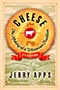 Cheese: Cover showing an aged cheese wheel containing the title text curved to match the curve of the cheese wheel. At the very center of the cheese wheel is a red and white cow icon, with a red, farm icon above it and a red, tractor icon below it. At the bottom of the cheese wheel is a red ribbon that says '2nd EDITION.' Behind the cheese wheel there is a manilla and green line drawing of rolling farmland. 