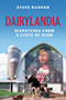 Dairylandia: Cover showing the Mona Lisa wearing a Wisconsin Badgers shirt painted on the side of a barn. Cows stand in front of the barn, and a blue sky hangs above it. 