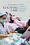 A Thai nurse with a light blue surgical mask writes on some paperwork. A row of patients in pink sheets and other caregivers in light blue is next to, and behind and to the right of her.