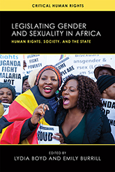 Legislating Gender and Sexuality in Africa: A group of people at a pro-LGBT protest in Uganda hold up signs. Two women are in the foreground, speaking into a microphone.