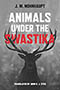 Animals Under the Swastika: cover depicting a grayscale buck staring straight ahead at the viewer. The background is blurry and indistinct. The all capps title text is written above the buck in white, with the word 'Swastika' interweaving the buck's large antlers written in red.