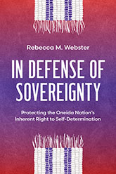 In Defense of Sovereignty: a red and purple cover with white and purple corn-like tassles emerging from the top and bottom of the page. The title text is written in all capps in the center of the page, between the two corn-tassles.